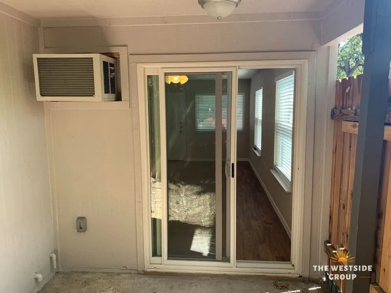 patio living space with sliding glass door on clarksville studios