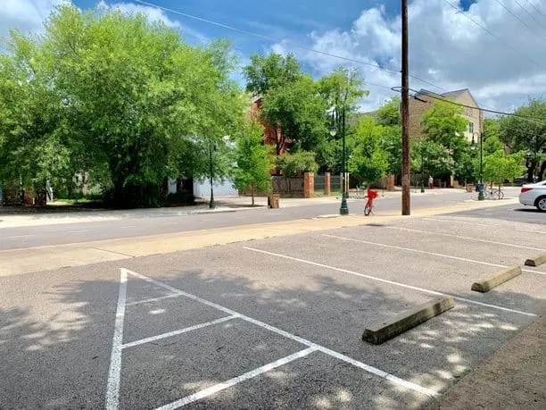 parking spaces facing street and building